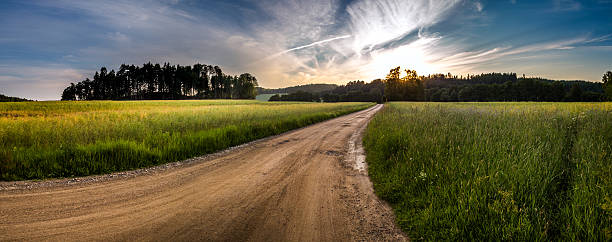 istock Brown gravel road to sunset 544469090