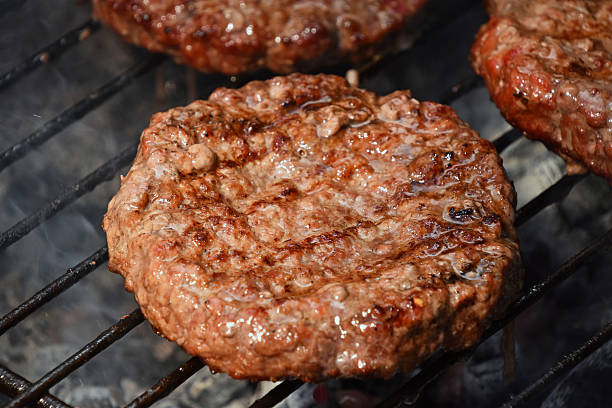 istock Meat burgers for hamburger grilled on grill 544469456