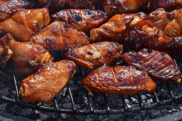 istock Chicken buffalo wings cooked on smoke grill 544470294