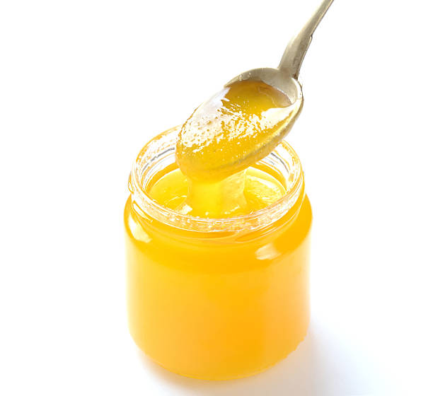 istock jar of honey and spoon on a white background 544470938