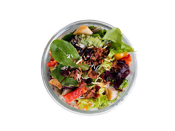 istock Top view of mixed salad in glass container isolated 544471744