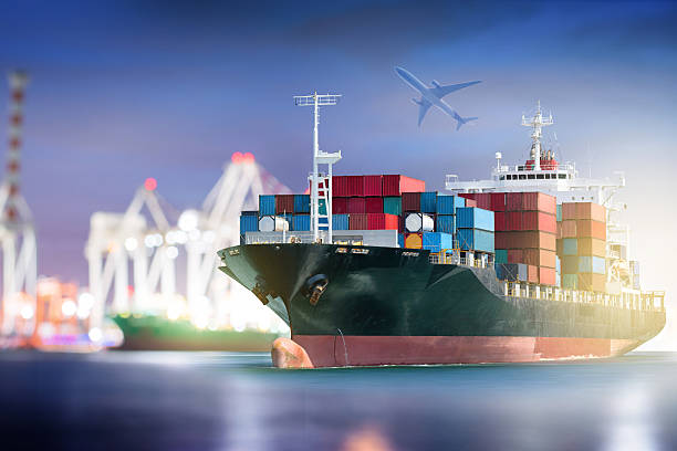 istock Container Cargo ship with ports crane bridge in harbor 544475598