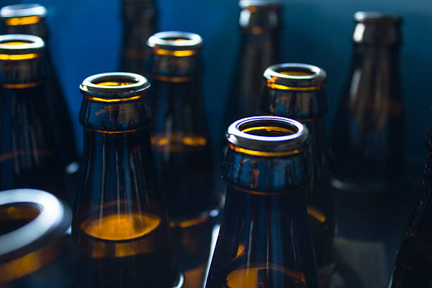 istock Brown Glass Bottles in Blue Bucket 544475836