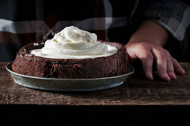 istock Mississippi Mud pie with cream on top 544477330