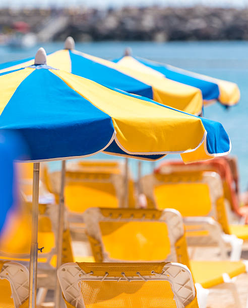 istock Sun umbrellas at sunny beach 544477806