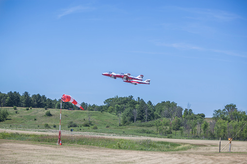 Gatineau, Canada- June 30, 2016: The Wings over Gatineau Airshow is a airshow at the Gatineau Executive Airport. This image shows the 3 airplanes of the Canadian Forces Snowbirds aerial demonstration team at the takeoff.