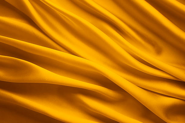Silk Fabric Background Yellow Satin Cloth Waves Sheets Texture Stock Photo  - Download Image Now - iStock