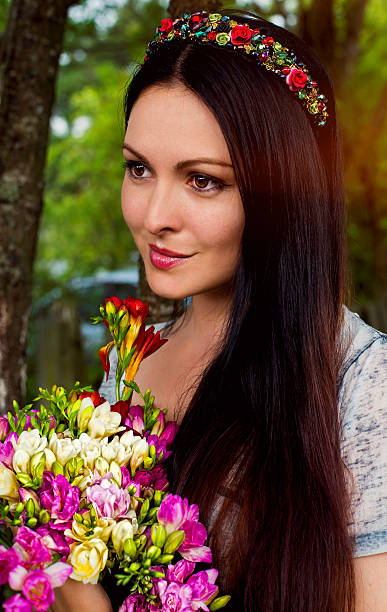 istock Beautiful woman with flowers 544478258