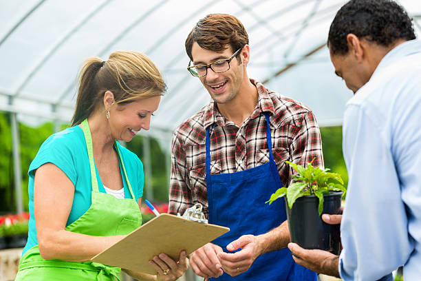 istock Local garderners and constumer in a greenhouse 544478292
