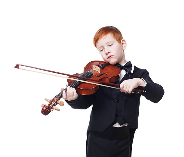 istock Cute redhead child boy plays violin isolated at white background 544480246