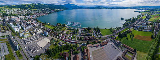 lago de zug - bringing home the bacon image high angle view vertical imagens e fotografias de stock