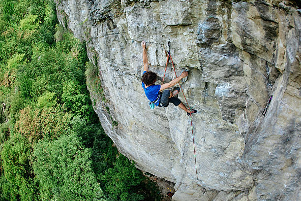 istock male rock climber on the cliff 544482886