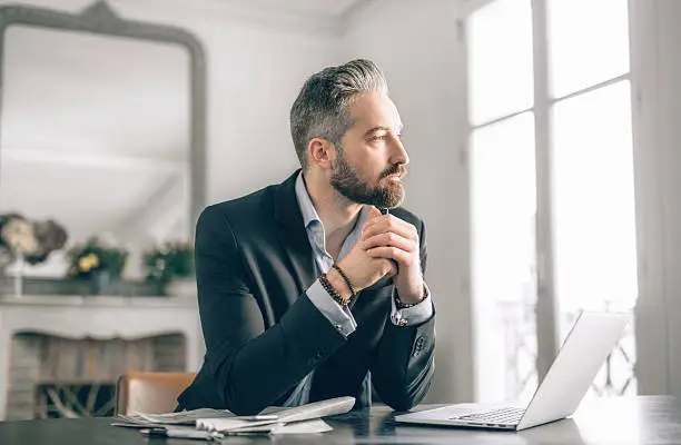 Photo of Businessman working from home