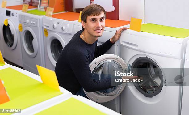 Man Choosing New Laundry Machine Stock Photo - Download Image Now - Appliance, Men, Part Of
