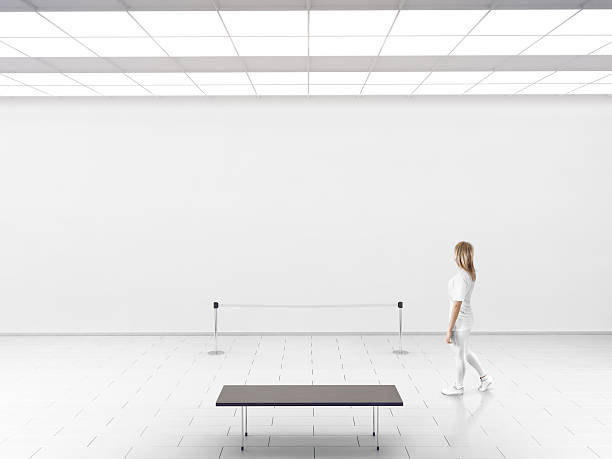 istock Modern gallery wall mockup. Woman walk in museum hall 544486014