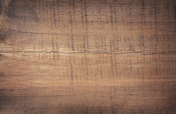istock Dark brown scratched wooden cutting board. Wood texture 544486560
