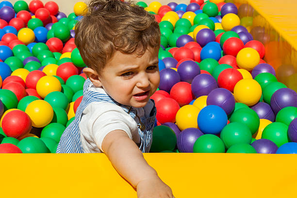 istock Baby boy having fun playing in a plastic ball pool 544487288