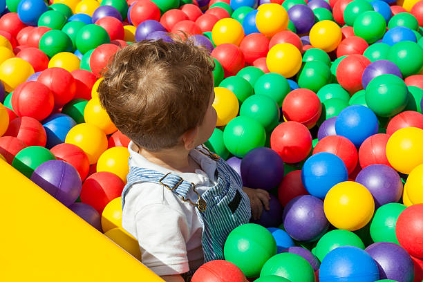 istock Baby boy having fun playing in a plastic ball pool 544487548