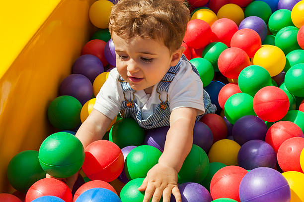 istock Baby boy having fun playing in a plastic ball pool 544487694