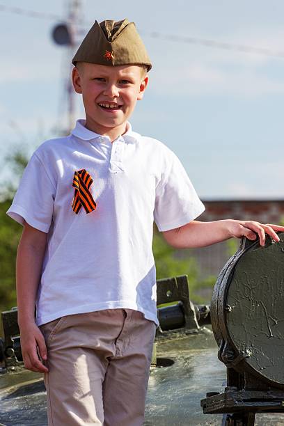 istock cute boy on Victory Day in uniform 544487746