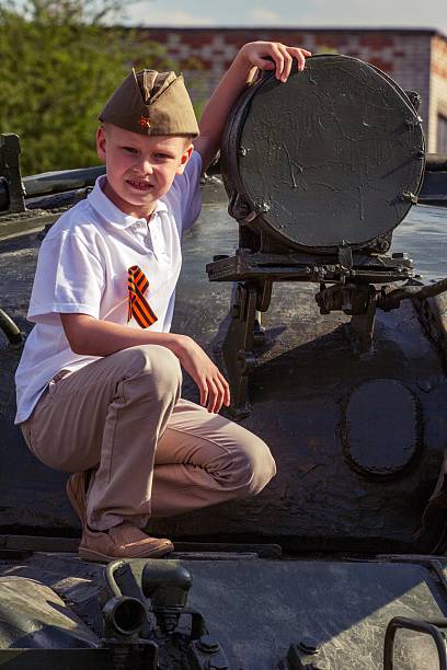 istock cute boy on Victory Day in uniform 544487848