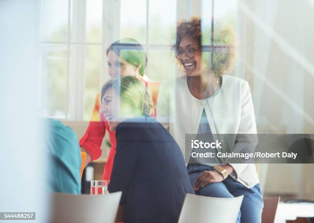Group Of Office Workers Talking At Desk Stock Photo - Download Image Now - 25-29 Years, 35-39 Years, Adult