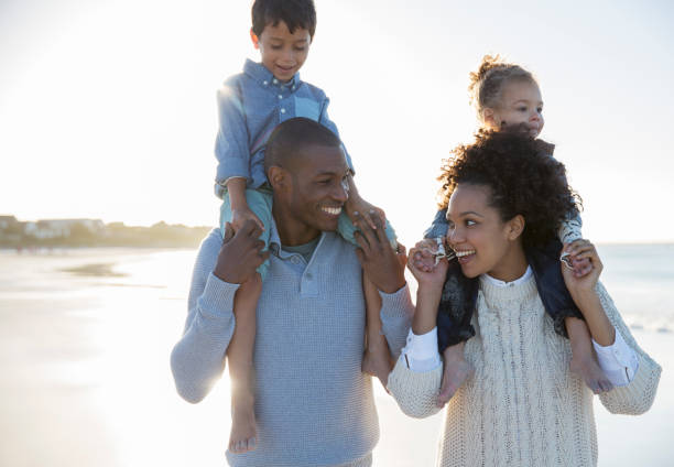 istock Happy family having fun on beach 544489277