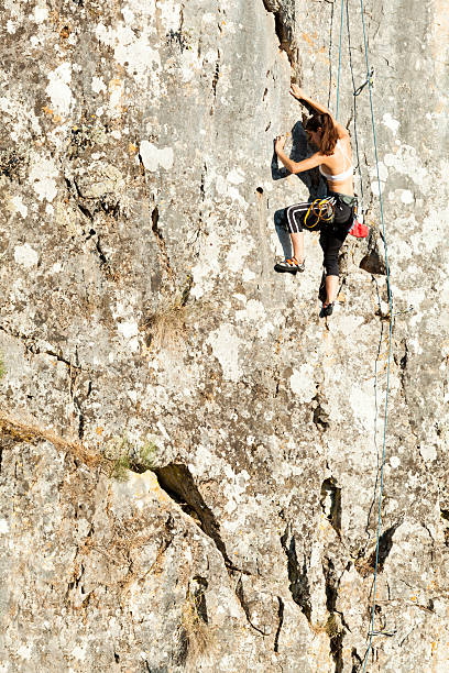 istock Woman climbing the mountain 544489300
