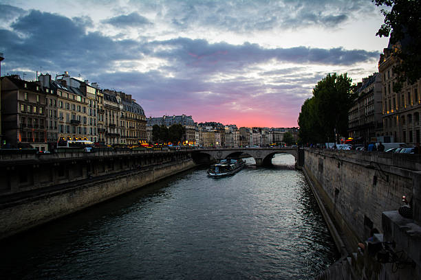 istock Sunset over Seine River with Ferry Boat 544489432