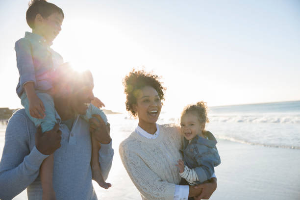 istock Happy family having fun on beach 544489445