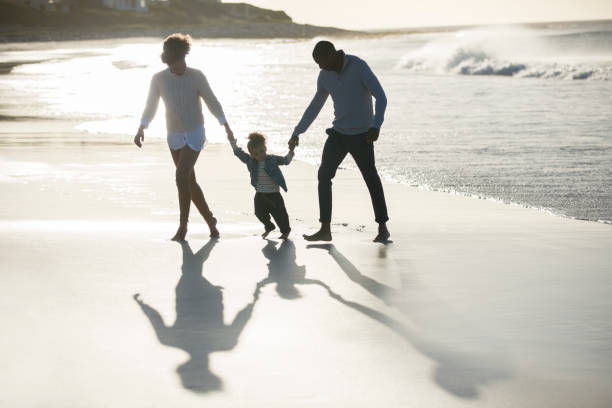 istock Happy family having fun on beach 544489859