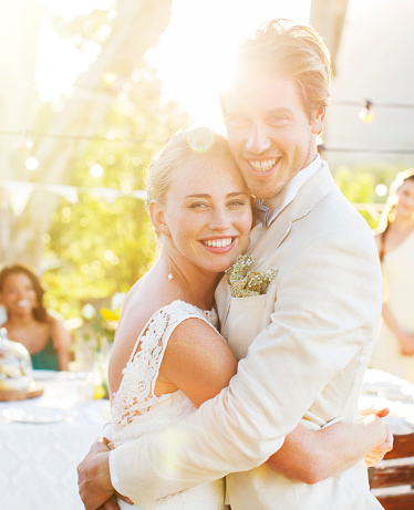 https://media.istockphoto.com/id/544489937/photo/portrait-of-young-couple-embracing-in-garden-during-wedding-reception.jpg?b=1&s=170667a&w=0&k=20&c=wzhwS_WaaIwWc80EBZiDqPKcf1yGQc8P4HJ5i07theQ=