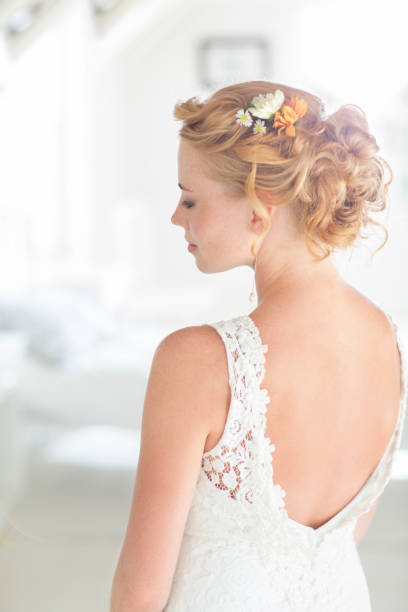 istock Young bride standing in sunny bedroom 544489961