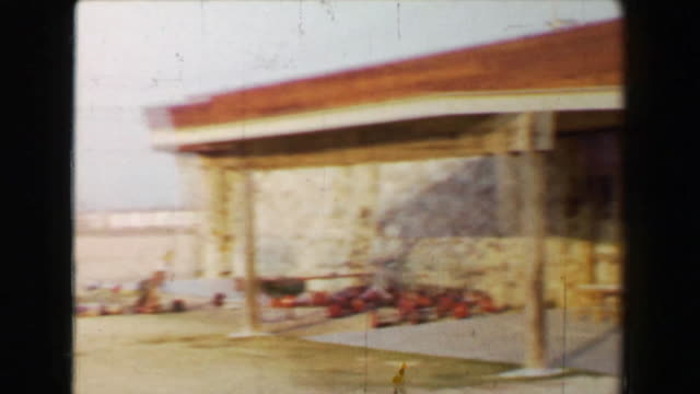 1968: Newly constructed golf clubhouse in barren southwestern USA desert driving carts.