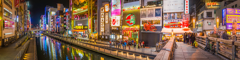 The colourful neon billboards illuminating the restaurants, bars and nightlife of Dotonbori, reflecting in the eponymous canal in the heart of Osaka, Japan's vibrant second city. ProPhoto RGB profile for maximum color fidelity and gamut.