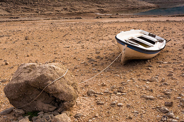 Abandoned old wooden boat near the lake