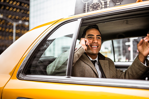 New York, NY, USA - July 5, 2022: Yellow cabs on the streets in Midtown Manhattan, New York City.