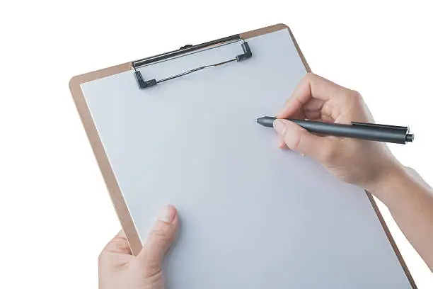 Photo of Writing on  Clipboard