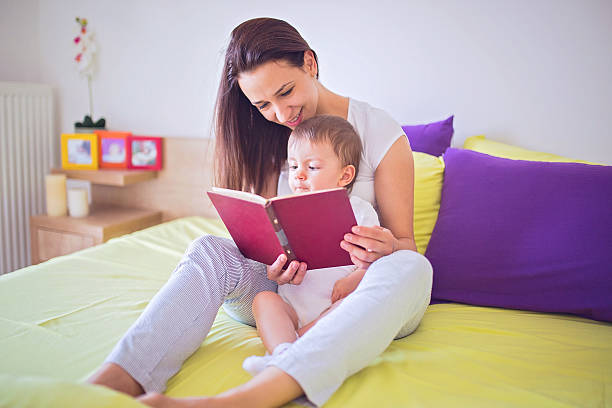 istock Mom reading to her child 544563936