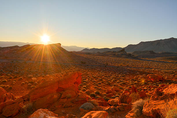 Scenic view of sunrise with sunburst over the Valley of Fire