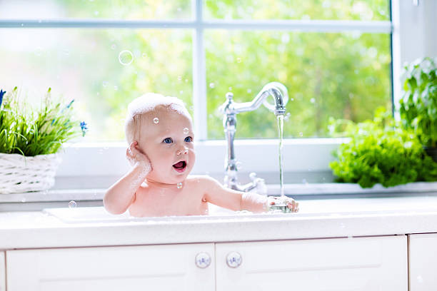 istock Little newborn baby taking bath 544567188
