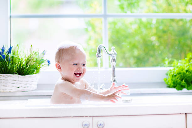 istock Happy little baby taking bath 544567418