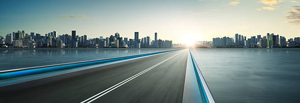 istock Highway overpass motion blur with city skyline background 544567492