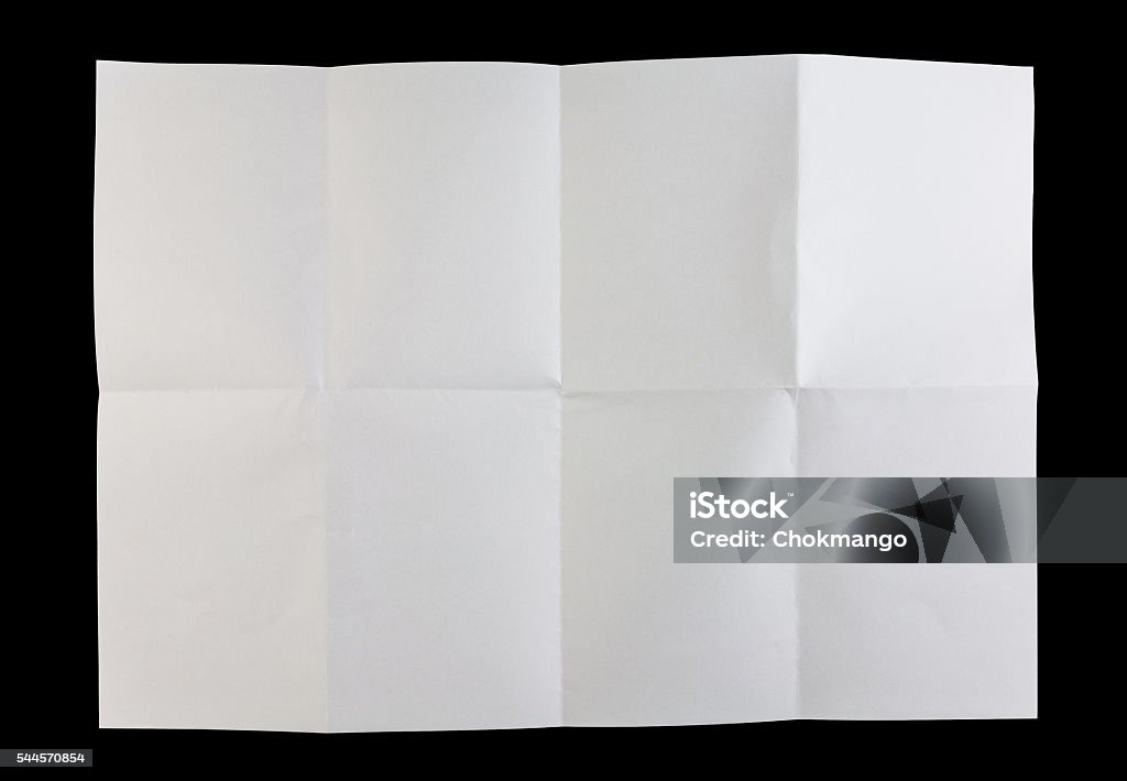 Folded white paper Full page of white paper folded and isolated on black background Folded Stock Photo