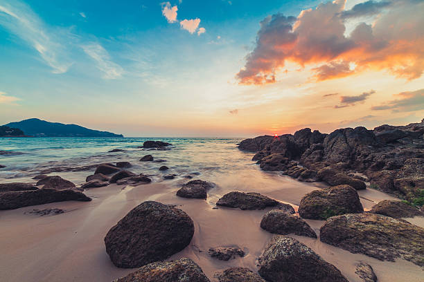 istock Sunset on the rocky beach 544571172