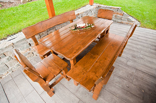 Garden wood table with candles stock photo