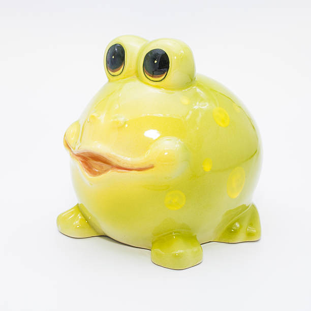 istock Ceramic green frog on a white background, piggy bank. 544576368