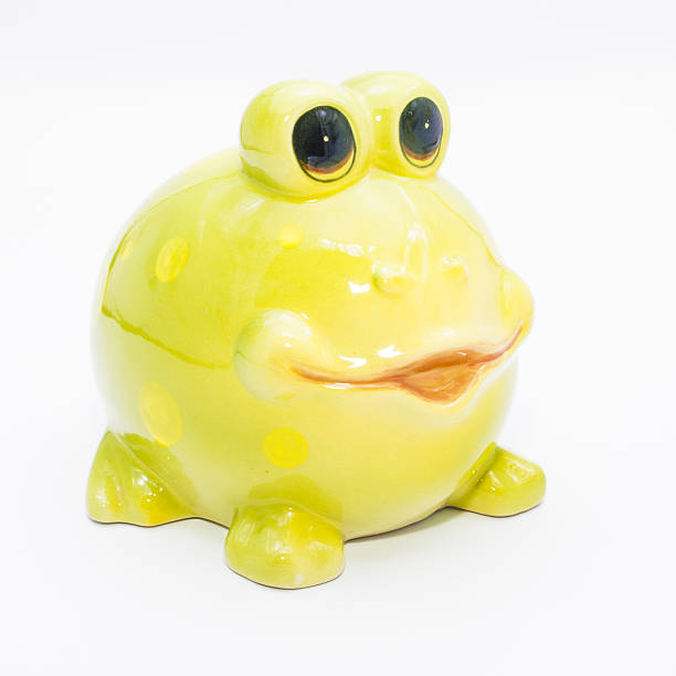 istock Ceramic green frog on a white background, piggy bank. 544576460