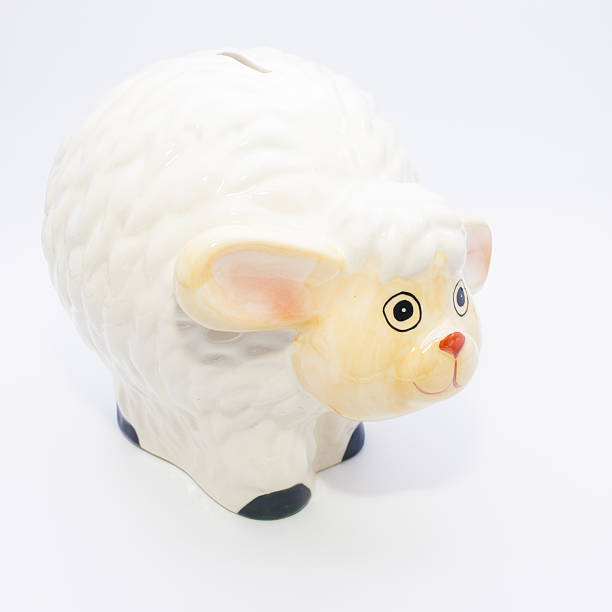 istock Ceramic sheep on a white background, piggy bank. 544576676