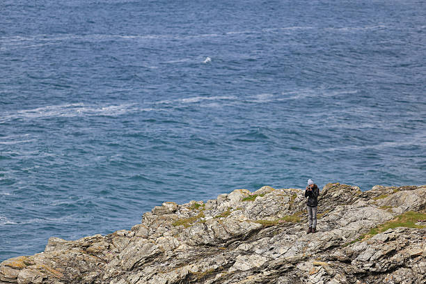 istock girl with a camera on a rock 544579640